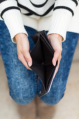 Image showing Woman with an empty wallet