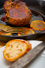 Image showing pork chop seared on iron skillet