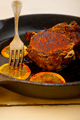 Image showing pork chop seared on iron skillet