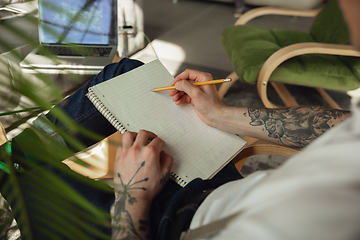 Image showing Close up of male hands writing on an empty paper, education and business concept