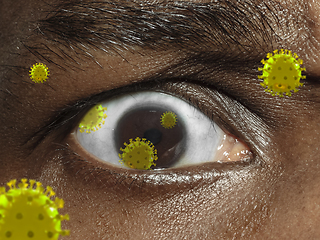 Image showing Close up shoot of a male eye with 3D-illustrated coronavirus models, the way of infecting