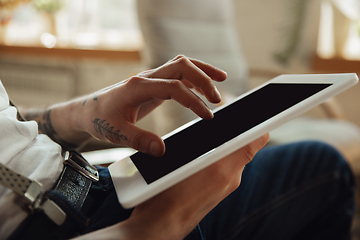 Image showing Close up of male hands using tablet with blank screen, copyspace, education and business concept