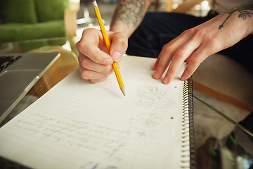 Image showing Close up of male hands writing on an empty paper, education and business concept