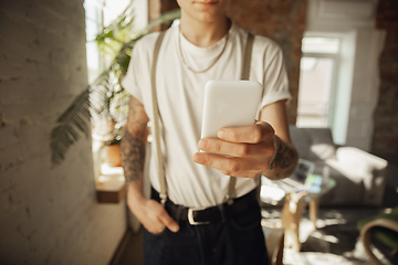 Image showing Close up of male hands using smartphone, education and business concept