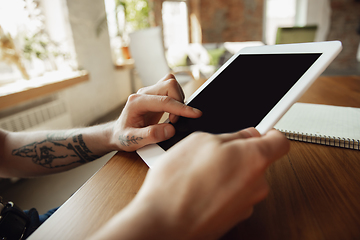 Image showing Close up of male hands using tablet with blank screen, copyspace, education and business concept