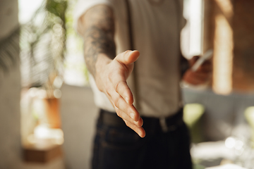 Image showing Close up of male hand greeting, welcoming somebody