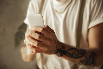 Image showing Close up of male hands using smartphone, education and business concept