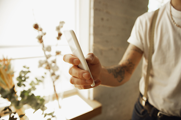 Image showing Close up of male hands using smartphone, education and business concept