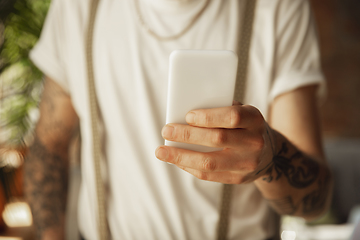 Image showing Close up of male hands using smartphone, education and business concept