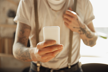 Image showing Close up of male hands using smartphone, education and business concept