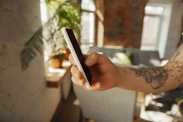 Image showing Close up of male hands using smartphone, education and business concept