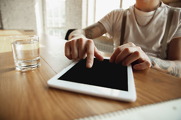 Image showing Close up of male hands using tablet with blank screen, copyspace, education and business concept