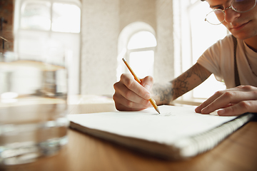 Image showing Close up of male hands writing on an empty paper, education and business concept