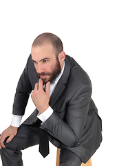 Image showing Business man with hand on chin thinking