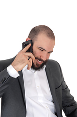 Image showing Smiling man with beard on the cell phone