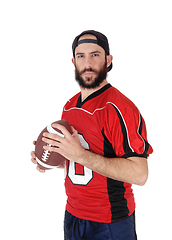 Image showing Young football player standing with his football in his hand