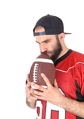 Image showing Football player holding his ball on his mouth, thinking