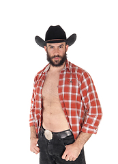 Image showing Young man with open shirt and cowboy hat