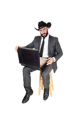 Image showing Business man looking in his briefcase