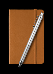 Image showing Leather closed notebook and pen isolated on black