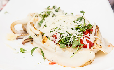 Image showing Cuttlefish with tomato, salad and Parmigiano cheese