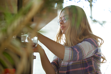 Image showing Portrait of gorgeous woman at home, cozy atmosphere, calm