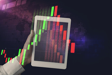 Image showing Hands holding tablet showing graphs going down. Double exposure with graphs, digital. Virus alert, coronavirus pandemic, crisis, unemployment