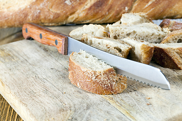 Image showing bread on a kitchen board