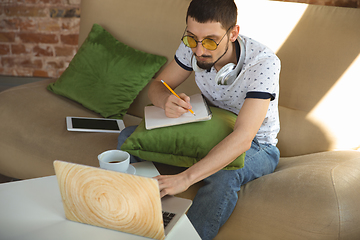 Image showing Man working from home during coronavirus or COVID-19 quarantine, remote office concept