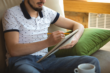 Image showing Man working from home during coronavirus or COVID-19 quarantine, remote office concept