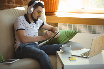 Image showing Man working from home during coronavirus or COVID-19 quarantine, remote office concept