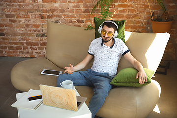 Image showing Man working from home during coronavirus or COVID-19 quarantine, remote office concept