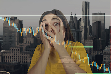 Image showing Stressed woman holding head with hands on abstract city background. Double exposure with graphs. Virus alert, coronavirus pandemic, crisis, unemployment