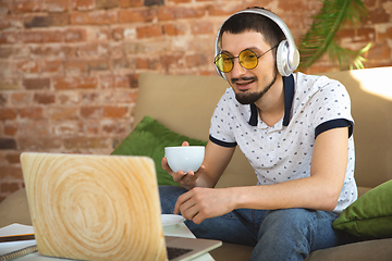 Image showing Man working from home during coronavirus or COVID-19 quarantine, remote office concept