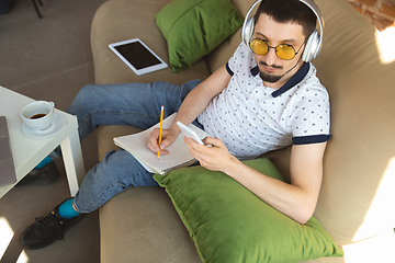 Image showing Man working from home during coronavirus or COVID-19 quarantine, remote office concept