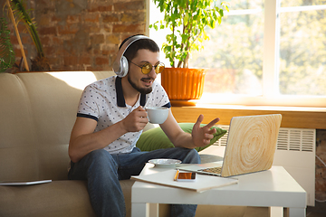 Image showing Man working from home during coronavirus or COVID-19 quarantine, remote office concept