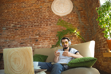 Image showing Man working from home during coronavirus or COVID-19 quarantine, remote office concept