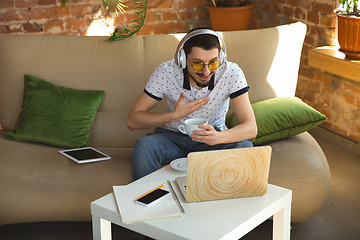 Image showing Man working from home during coronavirus or COVID-19 quarantine, remote office concept