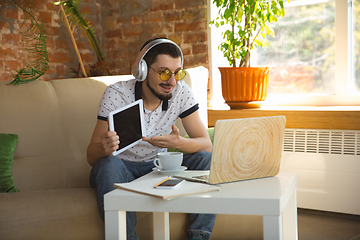 Image showing Man working from home during coronavirus or COVID-19 quarantine, remote office concept