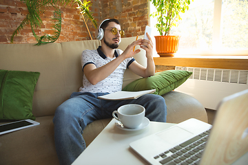 Image showing Man working from home during coronavirus or COVID-19 quarantine, remote office concept