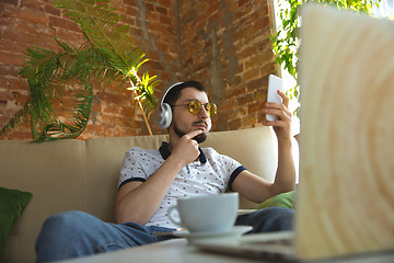 Image showing Man working from home during coronavirus or COVID-19 quarantine, remote office concept