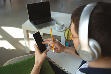 Image showing Man working from home during coronavirus or COVID-19 quarantine, remote office concept