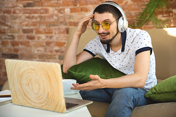 Image showing Man working from home during coronavirus or COVID-19 quarantine, remote office concept