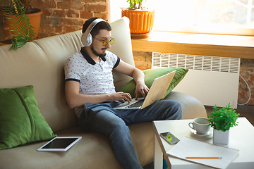 Image showing Man working from home during coronavirus or COVID-19 quarantine, remote office concept