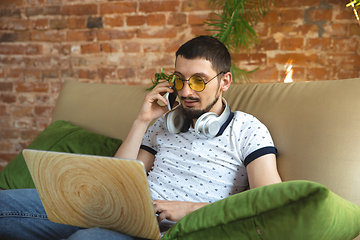 Image showing Man working from home during coronavirus or COVID-19 quarantine, remote office concept