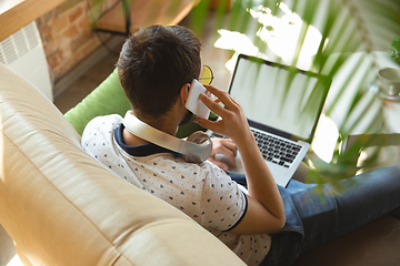 Image showing Man working from home during coronavirus or COVID-19 quarantine, remote office concept