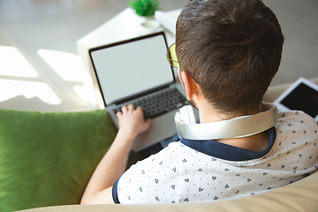 Image showing Man working from home during coronavirus or COVID-19 quarantine, remote office concept