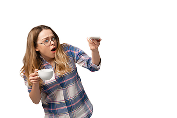 Image showing Emotional caucasian woman using smartphone isolated on white studio background, technologies. Scared, shocked