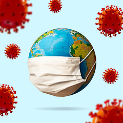 Image showing 3D-illustration of COVID-19 coronavirus colored red spreading near around planet Earth wearing face mask, concept of pandemic, protection