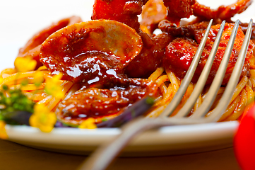 Image showing Italian seafood spaghetti pasta on red tomato sauce